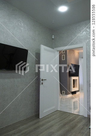 Two rooms in the house. The door is open. Two rooms in the house. The door is open. 128555586