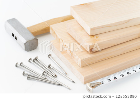 DIY image of nails, wood, hammer and tape measure on white background 128555880