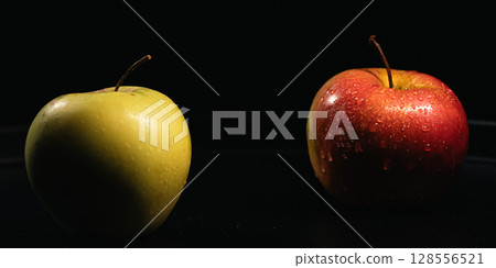 Red and Yellow Apples with Water Drops on Black Background Red and Yellow Apples with Water Drops on Black Background 128556521