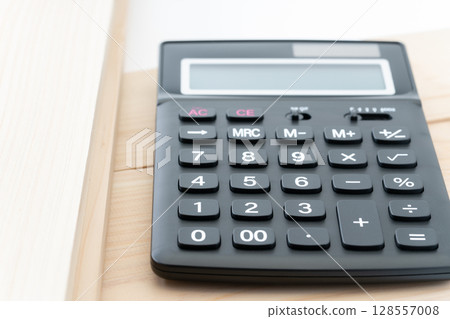 Calculator and wood Calculator and wood 128557008