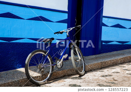 Bicycle at the beautiful streets of the colonial town of Concepcion in Antioquia, Colombia. Bicycle at the beautiful streets of the colonial town of Concepcion in Antioquia, Colombia. 128557223