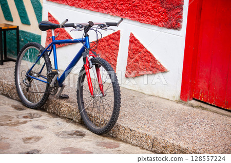 Bicycle at the beautiful streets of the colonial town of Concepcion in Antioquia, Colombia. Bicycle at the beautiful streets of the colonial town of Concepcion in Antioquia, Colombia. 128557224