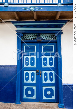 Blue antique door at the beautiful streets of the colonial town of Concepcion in Antioquia, Colombia. 128557227