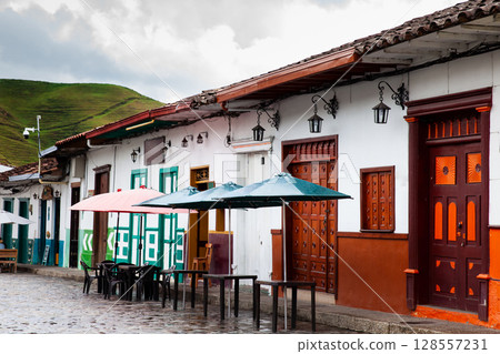 Concepcion, Colombia - 20 January 2024. Buildings around the Jose Maria Cordova Park in the beautiful colonial town of Concepcion in Antioquia, Colombia. Concepcion, Colombia - 20 January 2024. Buildings around the Jose Maria Cordova Park in the beautiful colonial town of Concepcion in Antioquia, Colombia. 128557231