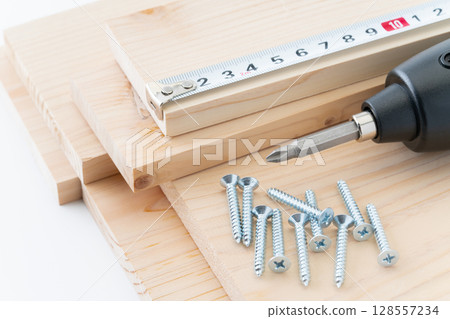 DIY image of tapping screws, wood, electric screwdriver and tape measure DIY image of tapping screws, wood, electric screwdriver and tape measure 128557234