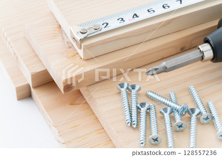 DIY image of tapping screws, wood, electric screwdriver and tape measure DIY image of tapping screws, wood, electric screwdriver and tape measure 128557236