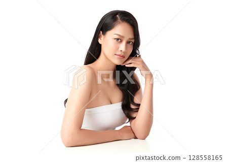 A beautiful young Asian woman with clean, fresh skin against a white background. Skincare, facial treatment, cosmetology, beauty, and spa. An elegant portrait of an Asian woman. A beautiful young Asian woman with clean, fresh skin against a white background. Skincare, facial treatment, cosmetology, beauty, and spa. An elegant portrait of an Asian woman. 128558165