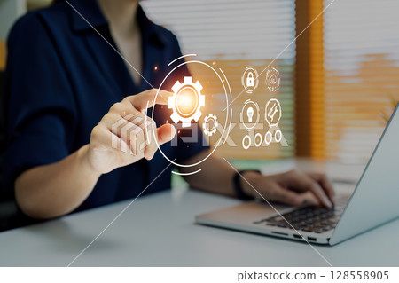 Business Professional Using Robotic Process Automation RPA Technology on Laptop in Modern Office Business Professional Using Robotic Process Automation RPA Technology on Laptop in Modern Office 128558905