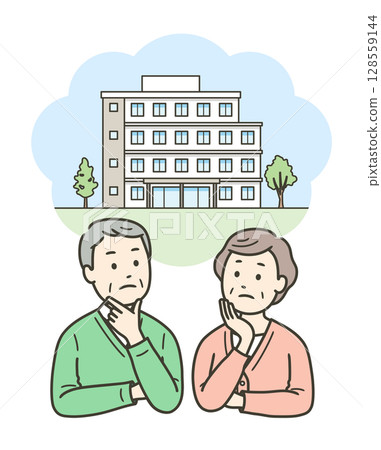 An elderly couple worried about moving into a nursing home or apartment 128559144