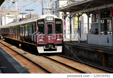 Express train bound for Takarazuka running through Hankyu Kiyoharajin Station Express train bound for Takarazuka running through Hankyu Kiyoharajin Station 128559762