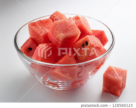 Cut watermelon in a glass container 128560123