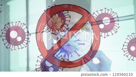 Stop sign over covid-19 cells moving against african american female doctor wearing face mask 128560210