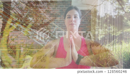 Image of garden over woman practicing yoga, exercising at home Image of garden over woman practicing yoga, exercising at home 128560246