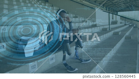 Image of data processing over disabled male athlete using smartphone with headphones on Image of data processing over disabled male athlete using smartphone with headphones on 128560445