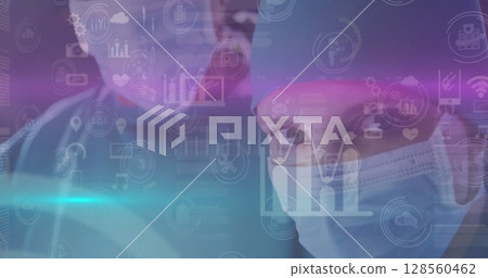 Image of data processing over surgeons wearing face masks Image of data processing over surgeons wearing face masks 128560462