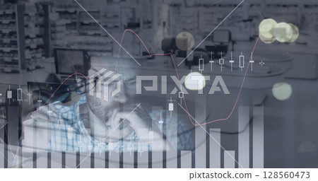 Image of tired businessman using computer, financial data processing over shop Image of tired businessman using computer, financial data processing over shop 128560473