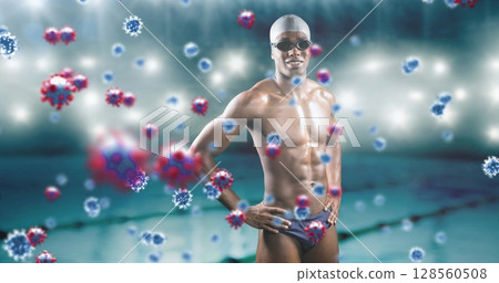 Covid-19 cells floating against african american male swimmer against swimming pool 128560508