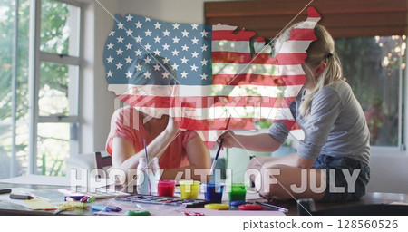 Independence text and american flag over us map against caucasian mother and daughter high fiving 128560526