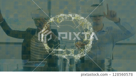 Image of human brain and medical data processing over business people wearing vr headsets Image of human brain and medical data processing over business people wearing vr headsets 128560578