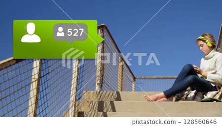 Image of speech bubble with people icon and numbers changing over woman using smartphone Image of speech bubble with people icon and numbers changing over woman using smartphone 128560646