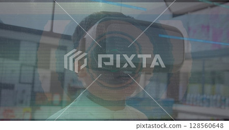 Image of scope scanning with glitch and boy using vr headset 128560648