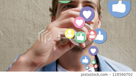 Image of social media icons over man drinking coffee 128560702