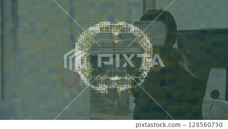 Image of human brain and medical data processing over businesswoman wearing vr headset 128560730