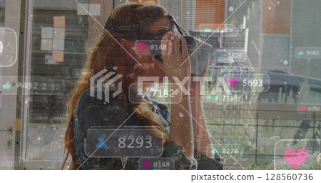 Image of social media icons over globe and woman using vr headset Image of social media icons over globe and woman using vr headset 128560736