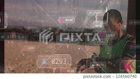 Image of social media icons over man using smartwatch and cityscape 128560740