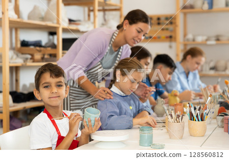 Boy at a master class for children on ceramics Boy at a master class for children on ceramics 128560812
