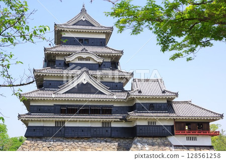 A view of the castle tower and stone walls of the national treasure Matsumoto Castle 128561258