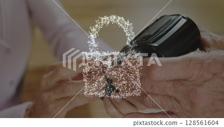 Image of network security padlock over people using payment terminal 128561604