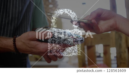 Image of network security padlock over people using payment terminal Image of network security padlock over people using payment terminal 128561609