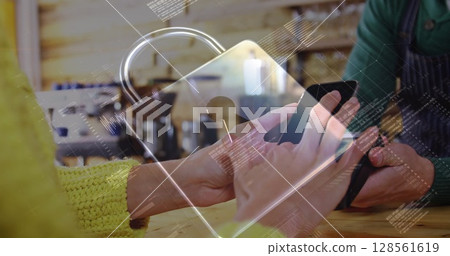 Image of network security padlock over people using payment terminal 128561619