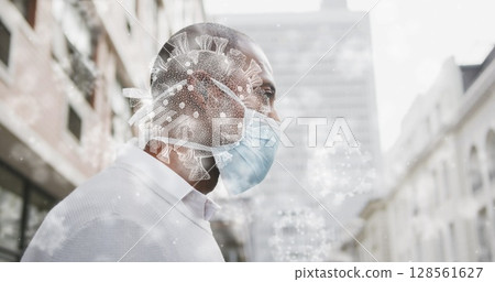 Image of covid 19 cells over man wearing face mask Image of covid 19 cells over man wearing face mask 128561627