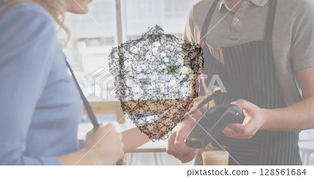 Image of network of connections with security shield over people using payment terminal Image of network of connections with security shield over people using payment terminal 128561684