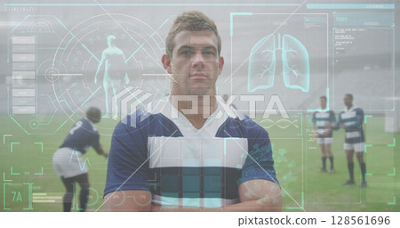 Rugby player standing confidently on field with digital health data overlay 128561696