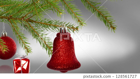 Image of fir trees branches and decorations over white background 128561727