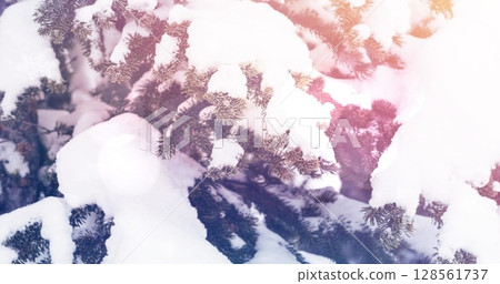 Image of spots of light over snow falling and winter landscape 128561737