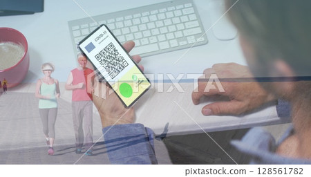 Image of man holding smartphone with covid 19 vaccination passport over senior couple running Image of man holding smartphone with covid 19 vaccination passport over senior couple running 128561782