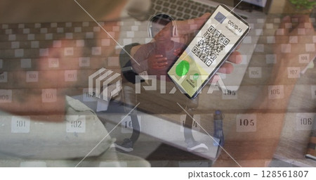 Man holding a smartphone with qr code on screen against man with prosthetics legs using smartphone Man holding a smartphone with qr code on screen against man with prosthetics legs using smartphone 128561807