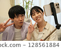 Couple taking a selfie Couple taking a selfie 128561884