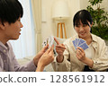 Men and women playing cards Men and women playing cards 128561912