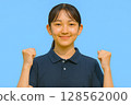 Junior high school student doing a fist pump and blue sky 128562000