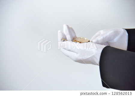 Image of an appraiser evaluating a watch Image of an appraiser evaluating a watch 128562013