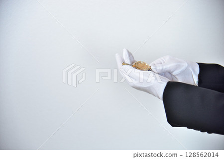 Image of an appraiser evaluating a watch Image of an appraiser evaluating a watch 128562014