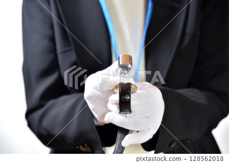 Image of an appraiser evaluating a watch 128562018
