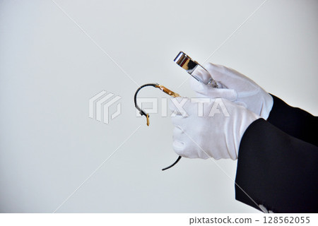 Image of an appraiser evaluating a watch Image of an appraiser evaluating a watch 128562055