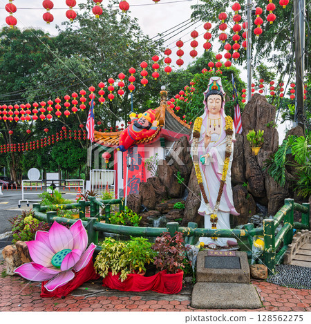 Statue of Yue Lao, God of Love and Marriage and festive red Chinese lanterns at Thean Hou Temple, Kuala Lumpur, Malaysia 128562275