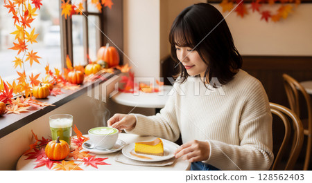 Women's relaxing time on the autumn terrace, cafe time 128562403